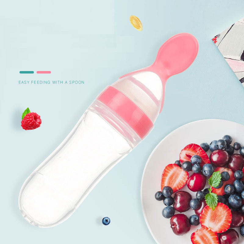 Cuillère biberon en silicone rose pour purée